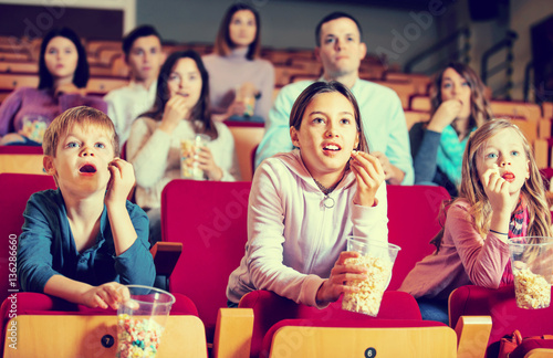 Number of people enjoying film screening and popcorn © JackF