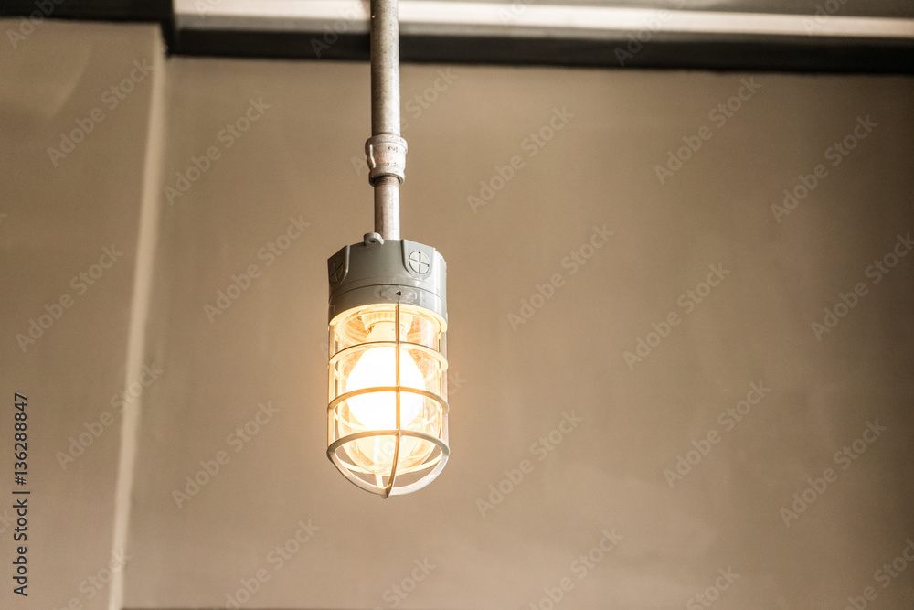 Old lamp illuminating with yellow light. Vintage style photography