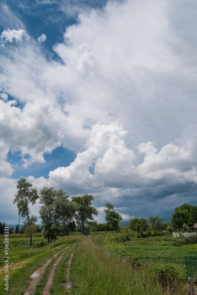 Path through the countryside with dramatic sky in the background