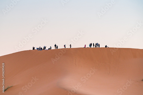 group of people in desert

