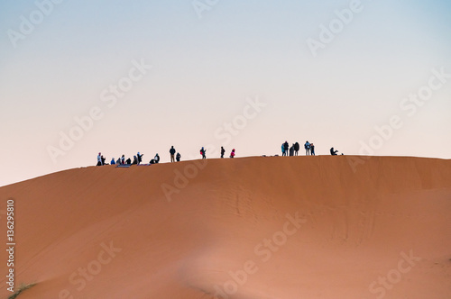 group of people in desert  