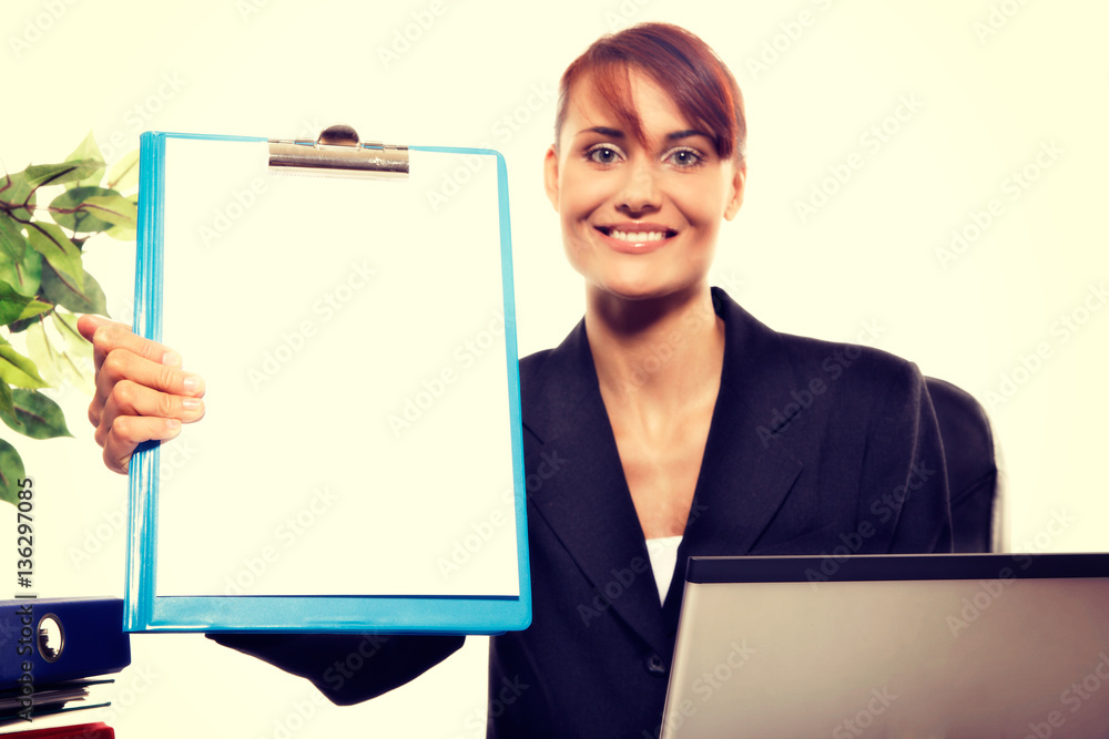 Young attractive business woman using laptop at the office Young attractive business woman using laptop at the office