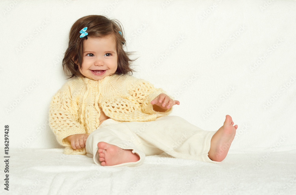 happy little child girl sit on white towel, happy emotion and face expression, yellow toned happy little child girl sit on white towel, happy emotion and face expression, yellow toned