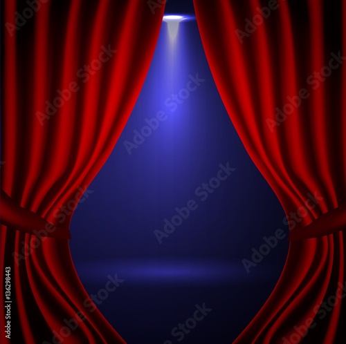 A scene with a red curtain and festive illuminations,