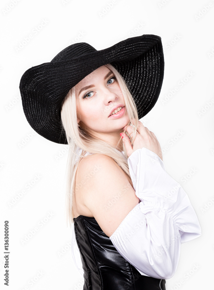 sexy woman with hourglass figure dressed in black leather corset with wide-brimmed hat sexy woman with hourglass figure dressed in black leather corset with wide-brimmed hat