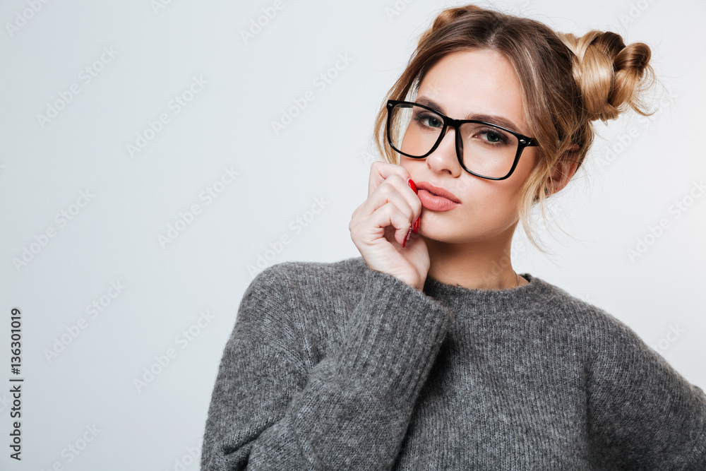 Portrait of beautiful young woman in glasses and grey sweater Portrait of beautiful young woman in glasses and grey sweater