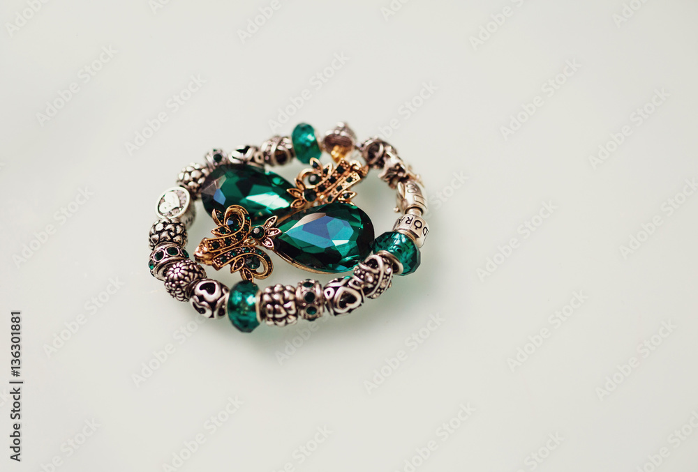 The bracelet and earrings stand on the table The bracelet and earrings stand on the table