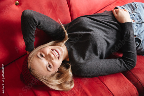 Top view of Woman lying on armchair