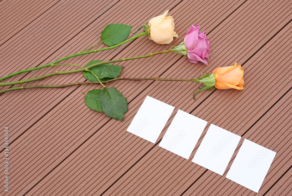 Empty notepaper with pink rose flower on wooden. Empty notepaper with pink rose flower on wooden.