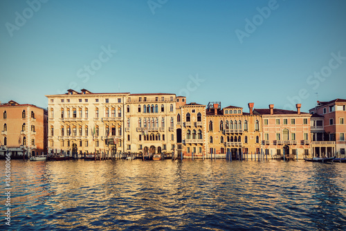 Typical venetian buildings from the waterside of Grand Canal int the golden hour, Venice (Venezia), Italy, Europe, Vintage filtered style © AR Pictures