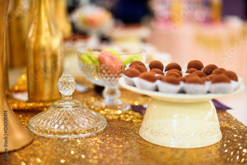 golden candy bar with truffle candies