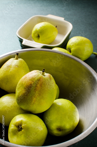 Fresh pears fruit in a bowl on green background,healthy food © nungning20