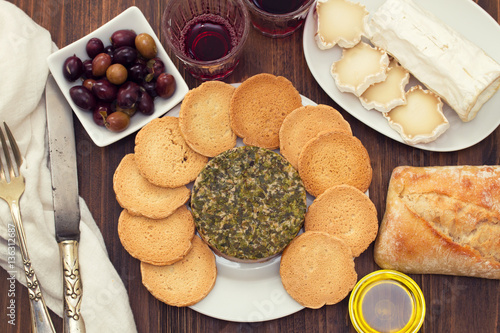 pate with herbs and toasts on white dish