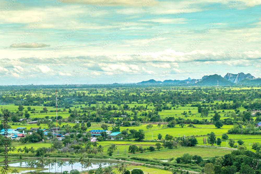 Thailand landscape of rural city and moutain under the blue sky.