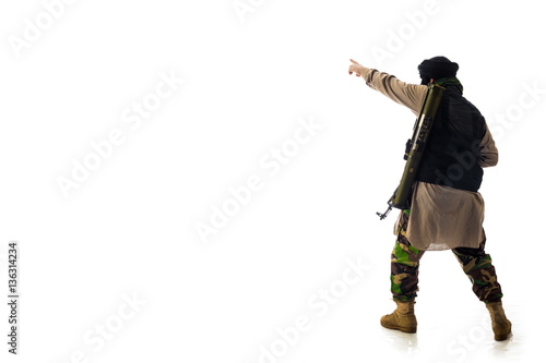 man in military outfit warrior Mujahedin in modern times on a white background in studio photo