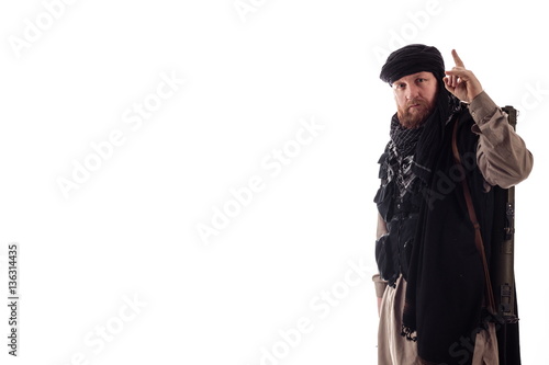 man in military outfit warrior Mujahedin in modern times on a white background in studio photo