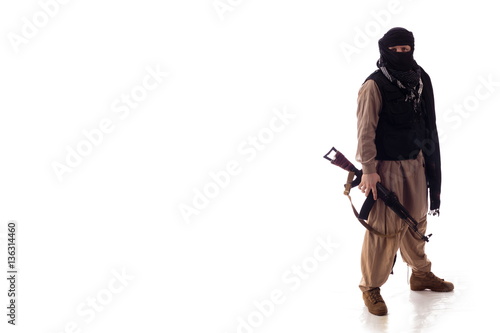 man in military outfit warrior Mujahedin in modern times on a white background in studio photo