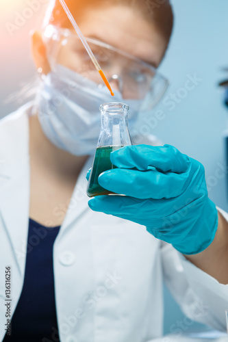 Woman in mask at lab