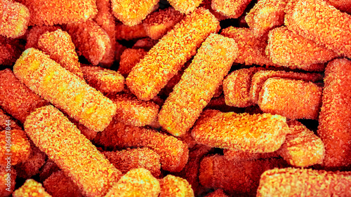 Half-finished fish sticks at frozen shop basket