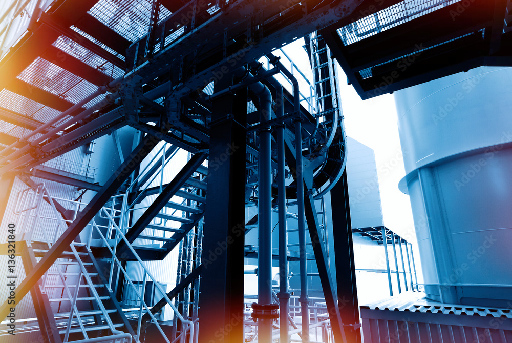 Fototapeta premium Industrial zone, Steel pipelines and cables in blue tones