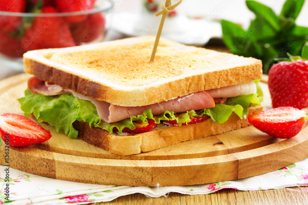 Dietary turkey sandwich and strawberry. Dietary turkey sandwich and strawberry.