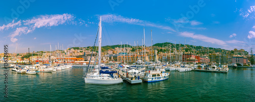 Panorama of marina Porto Antico Genova, where many sailboats and yachts are moored, Genoa, Italy. © Kavalenkava