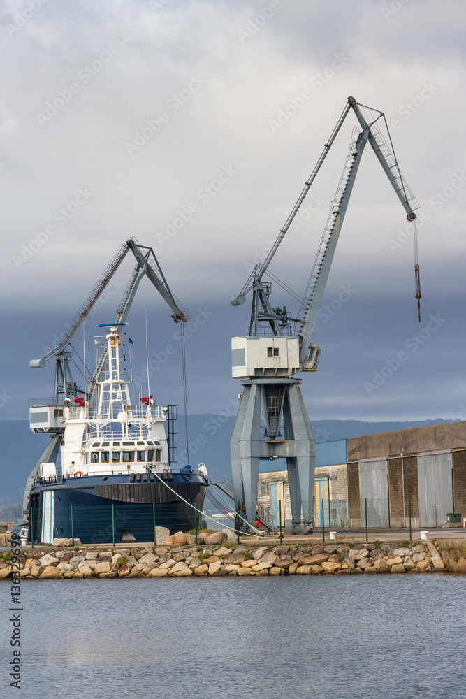 Boat and cranes at harbor