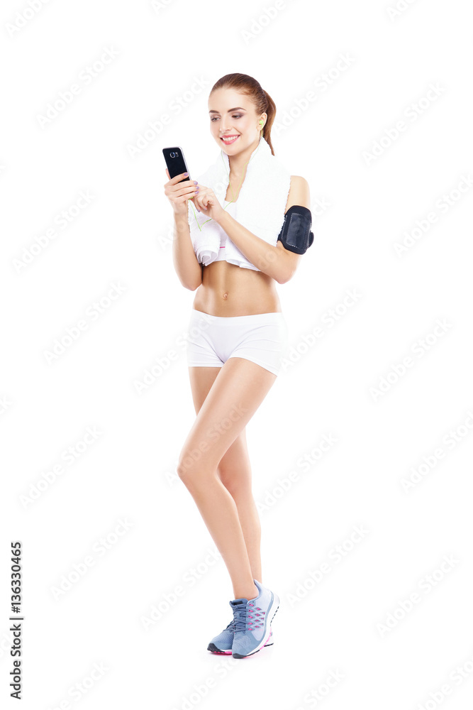 Fit, healthy and sporty woman in sportswear isolated on white. Fit, healthy and sporty woman in sportswear isolated on white.