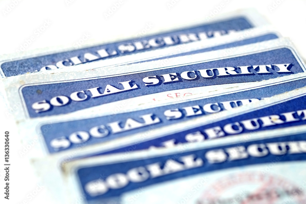 Obraz premium Social Security Cards in a Row Pile for Retirement