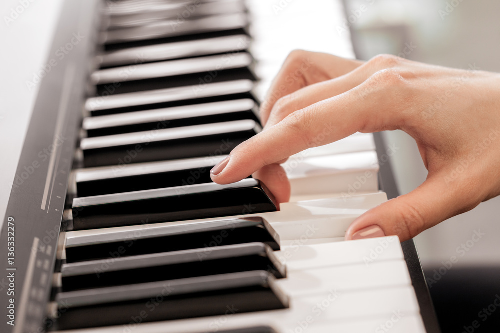 Closeup of hands playing piano. Music and hobby concept Closeup of hands playing piano. Music and hobby concept
