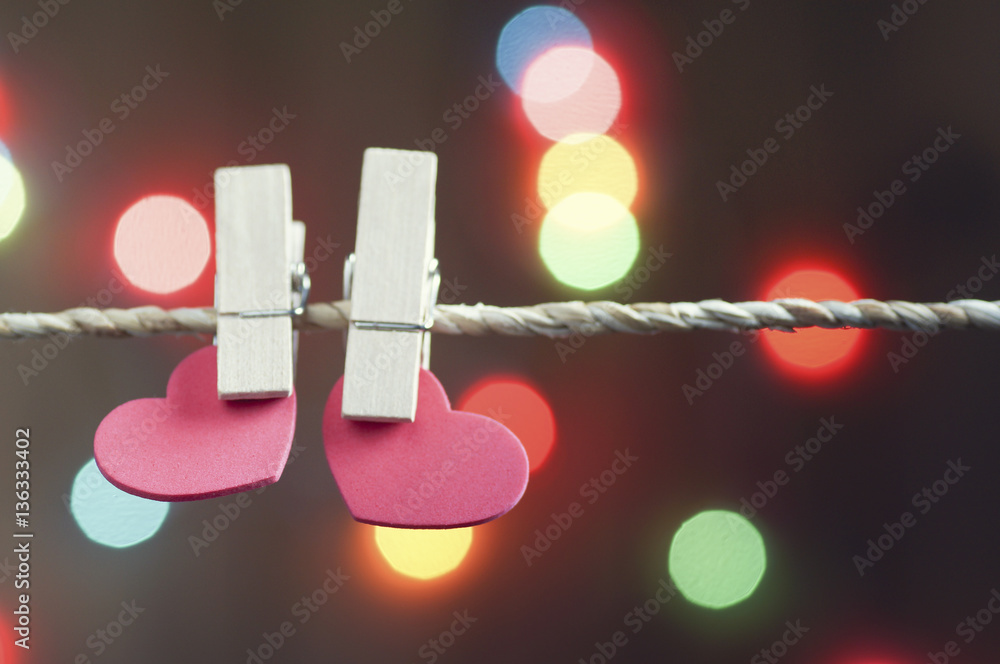 heart holding on rope with blur bokeh background heart holding on rope with blur bokeh background