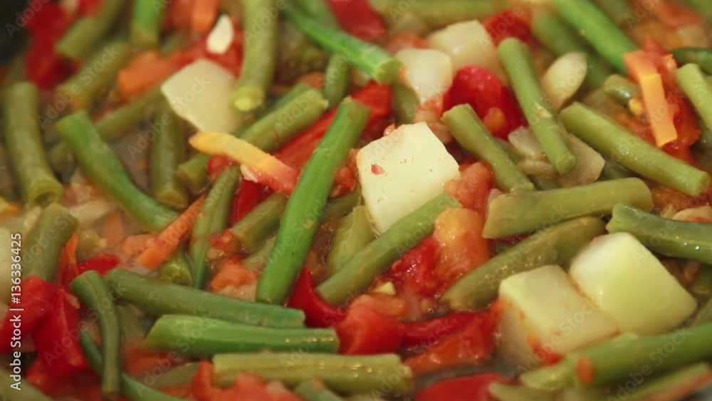Frying vegetables in the pan.