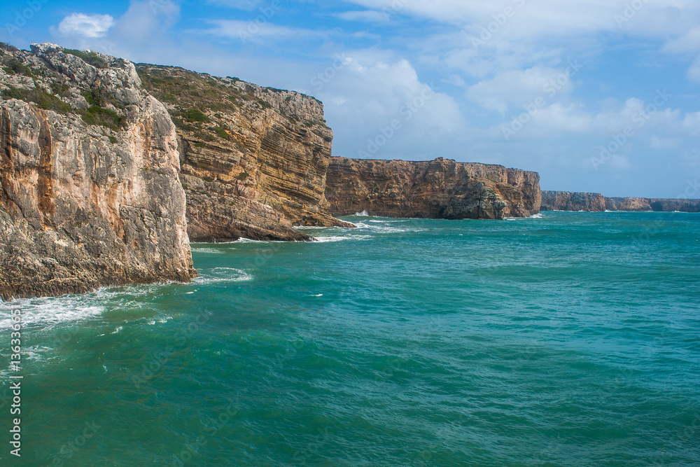 Cliffs at Cape Saint Vicent in Algarve region on a windy day. Portugal.
