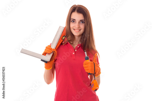 beauty brunette lady builder makes renovation isolated on white background
