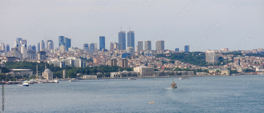 Obraz premium Skyscrapers and modern office buildings in Istanbul, Turkey. The Bosphorus or Straits of Istanbul is a strait separating the European part - from the Asian side: Anatolia of Turkey.