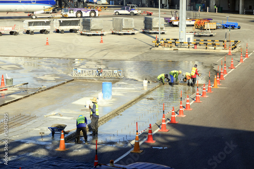 technician doing roadwork in air port