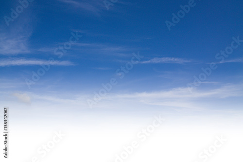 blue sky background with tiny clouds © onairjiw