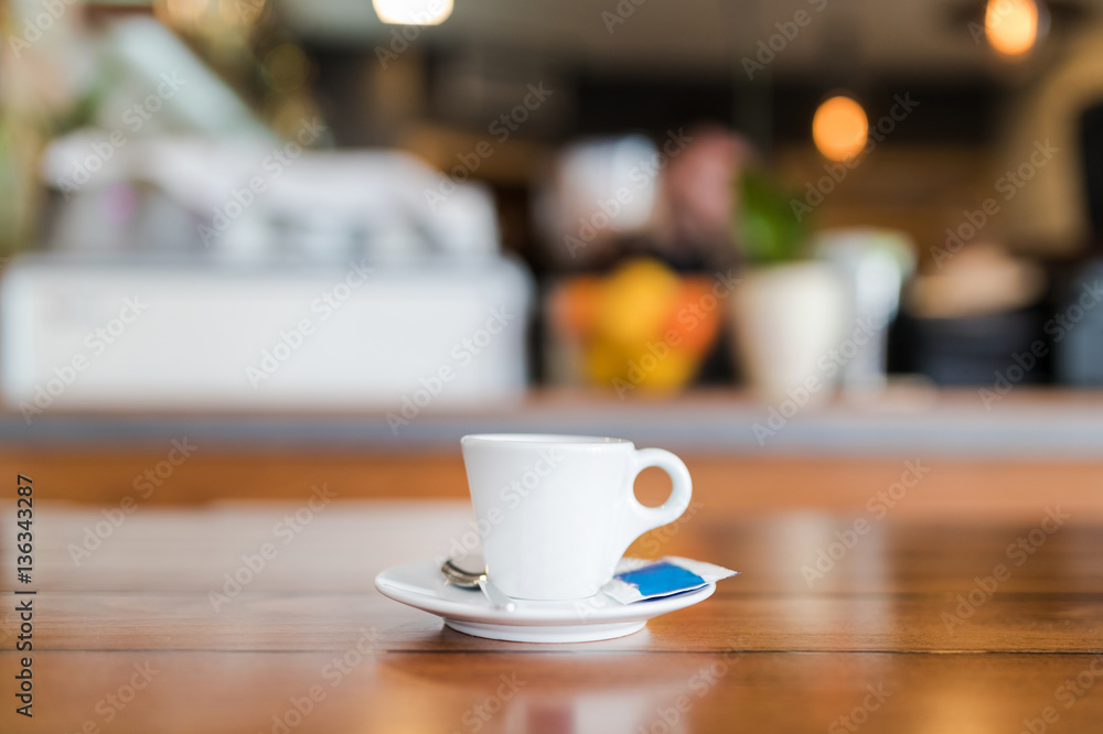 Espresso cup served on a plate with sugar and spoon. Espresso cup served on a plate with sugar and spoon.