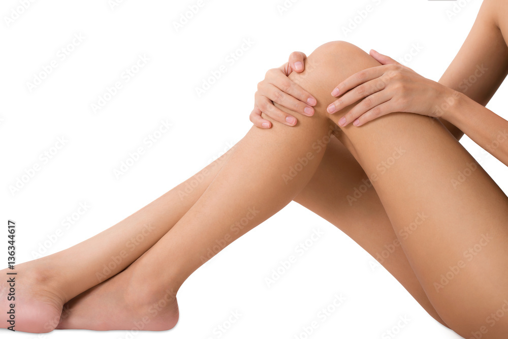 woman sitting and holding with massaging her knee and thigh in pain area, Isolated on white background. woman sitting and holding with massaging her knee and thigh in pain area, Isolated on white background.
