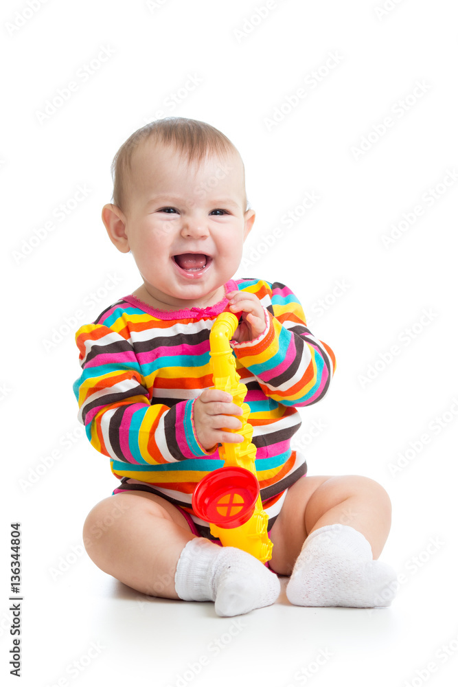 Funny baby girl with musical toy isolated Funny baby girl with musical toy isolated