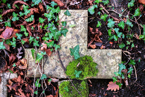 Graveyard ground with cross photo