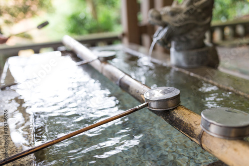 Japanese wooden ladle in shrine © leungchopan
