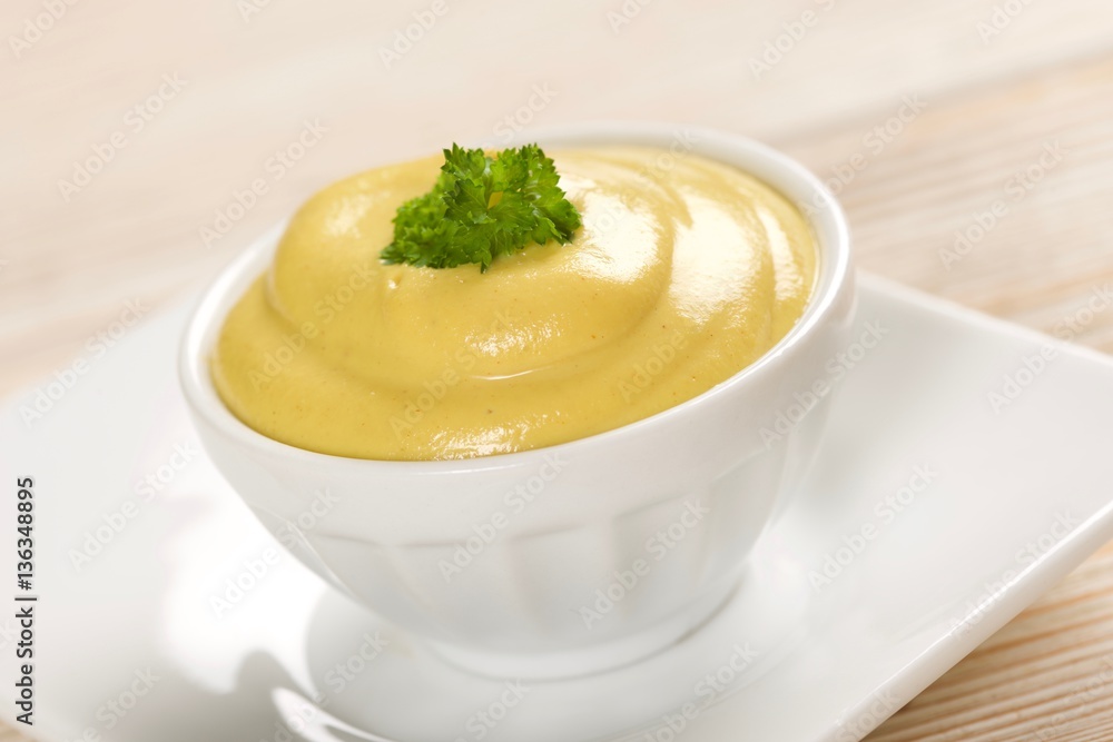 mustard on a wooden background mustard on a wooden background
