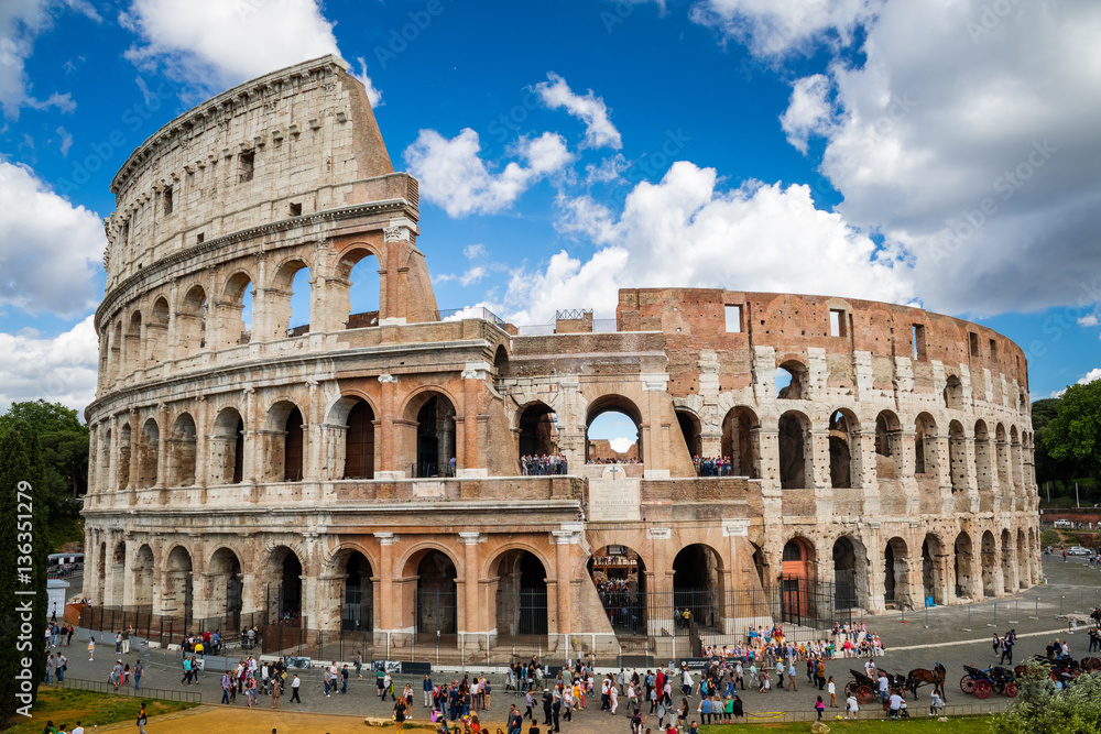 Colosseum with clear blue sky and clouds. Rome, Italy