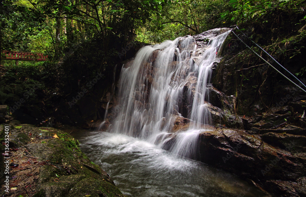 Naklejka premium A beautiful waterfall inside tropical rainforest. Long exposure and slow shutter