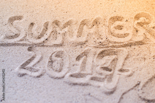 Macro Summer inscription on the sand at the beach