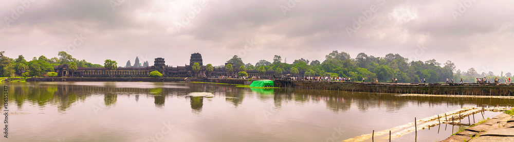 Angkor Wat temple with reflecting in water. Panoramic view Angkor Wat temple with reflecting in water. Panoramic view