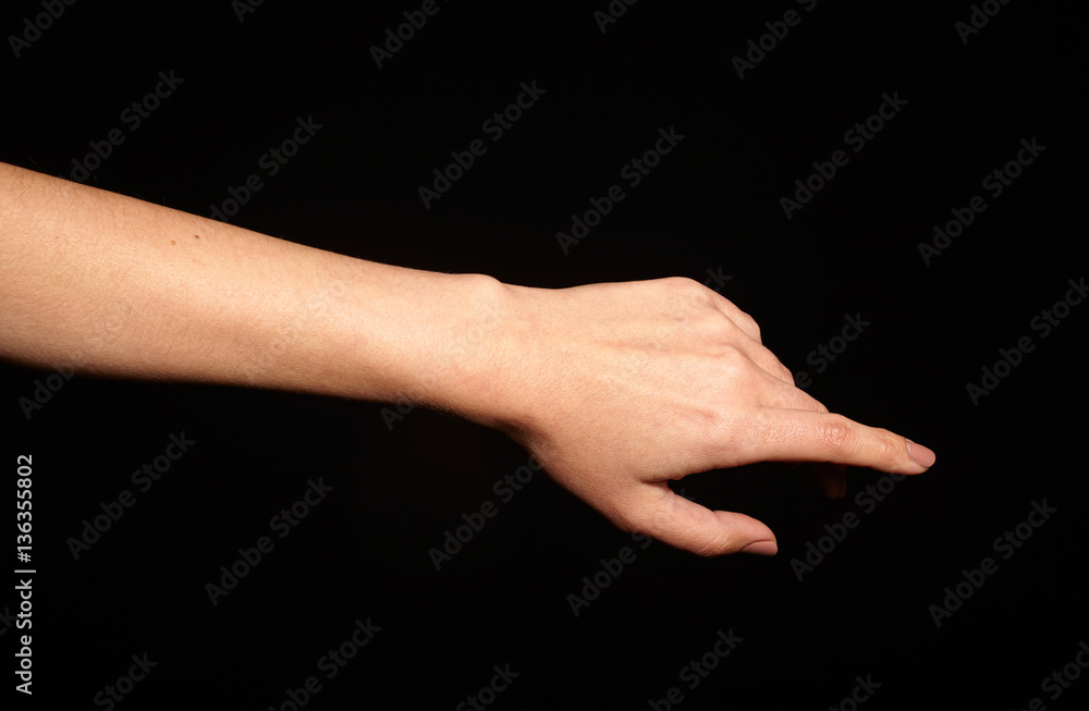 Female gesture hand isolated on black background