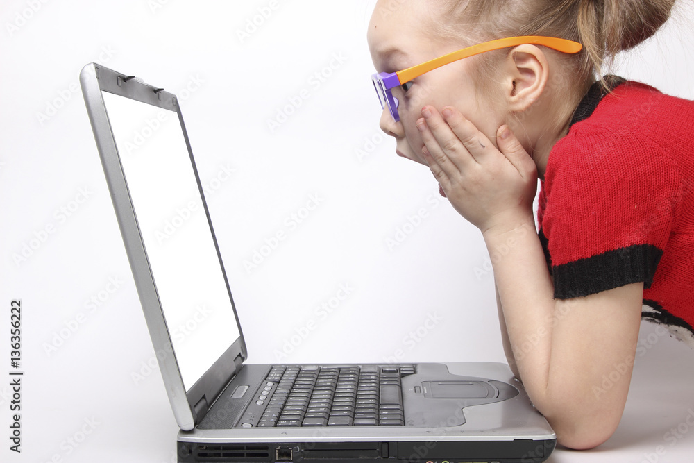 girl shocked by the laptop screen. isolated white background. orange ...