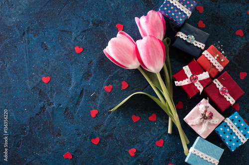 pink tulip flowers and gift boxes on blue rustic , breakfast on Mothers day or Women day